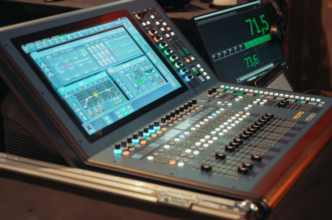 Instructor guiding a trainee through hands-on control room exercises