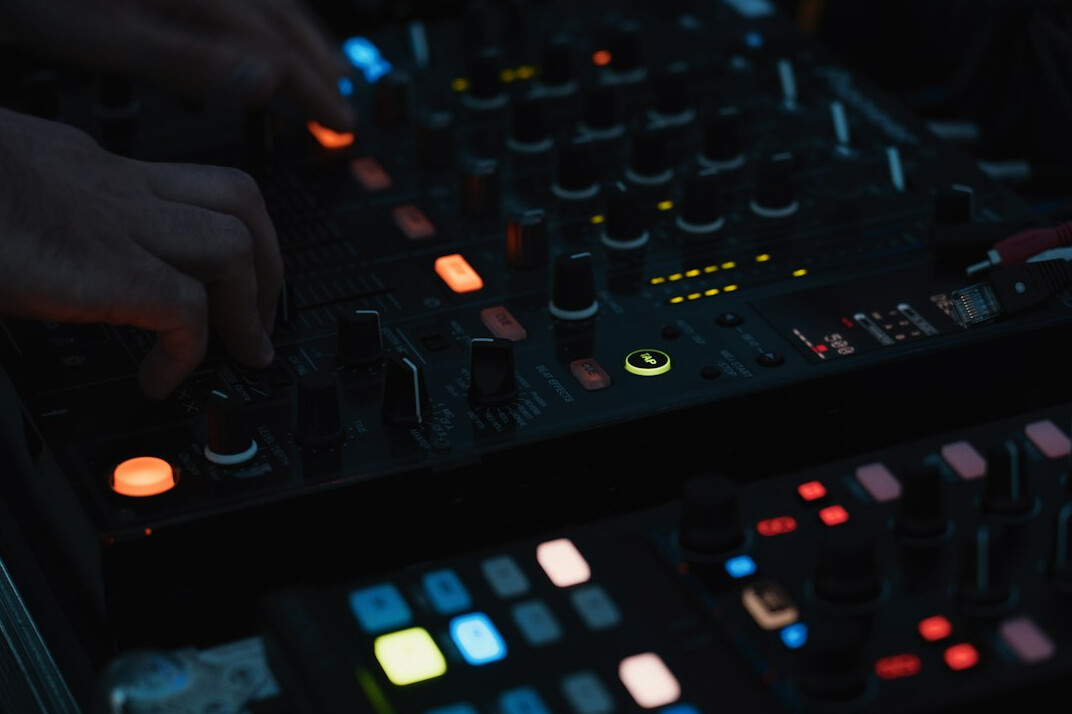 Hands programming macros on an advanced vision mixer panel